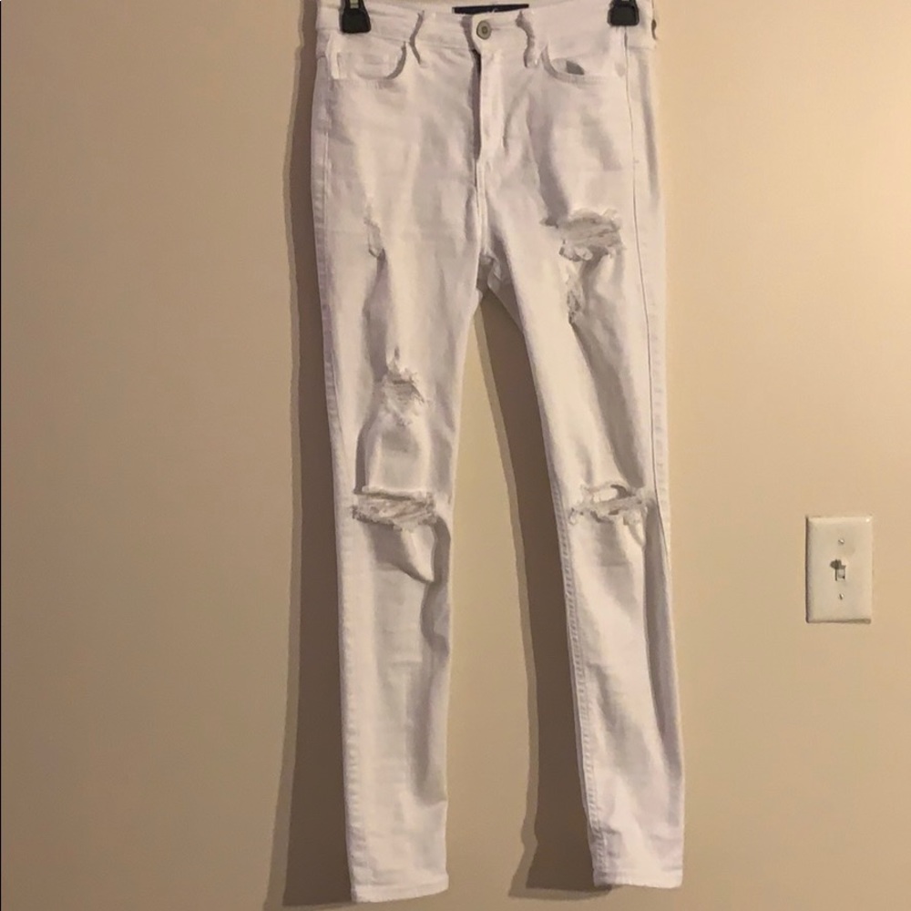 High rise white super skinny ripped jeans